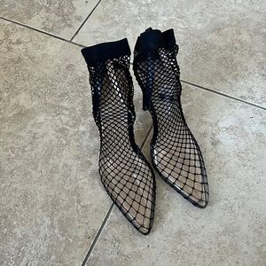 Pretty little thing fishnet heels.